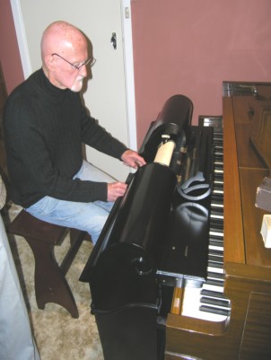 Denis Condon 'pedalling' a 65-note Aeolian push-up player (2006)